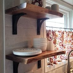 a kitchen counter with dishes on top of it