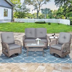 an outdoor patio furniture set with grey cushions