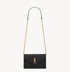 Elevate your everyday style with this stunning Saint Laurent Black Grained Leather Classic Cassandra Wallet on Chain Bag YSL. Crafted from high-quality leather, this crossbody bag is both durable and stylish. The black exterior is accented with a bold gold YSL logo, making it a perfect accessory for any fashion-forward woman. The small size is perfect for carrying just your essentials, while the black lining adds a touch of sophistication to the overall design. The handle/strap color is also black, which adds a sleek and modern touch to the classic theme of the bag. This Saint Laurent Cassandra Wallet is a must-have for any woman who wants to add a touch of luxury to her everyday look.