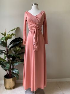 "Vintage 60s dress or 70s by Doncaster Mauve rosy color soft and luxe feeling The dress is maxi and can be worn with or without the shawl The shawl has a wrap feature and may be worn a few different ways, as shown in the pics The dress is measured laying flat Bust 17\" across Waist 14\" across Hips 20\" across Length 54\" Zips at back The sleeves are 18\" from armpit and the shoulders are 14\" seam to seam Both in excellent condition" Modest Pink Maxi Dress For Fall, Pink Floor-length Maxi Dress For Fall, Pink Floor-length Fall Dress, Pink Fall Evening Maxi Dress, Modest Pink Maxi Dress For Party, Modest Pink Party Dress, Pink Modest V-neck Dress, Modest V-neck Pink Dress, 70s Formal Dress