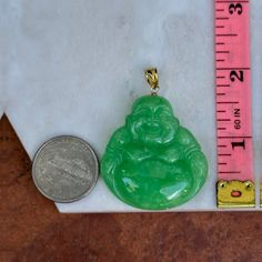 Estate/ vintage 14KT yellow gold genuine, carved green Jade Buddha pendant. Beautiful, shaped, vibrant green jade that is marbled like color. Pendant measures: 40mm x 38mm not including bail Bail inside approx. 8mm x 4mm; tapers Classic Chinese buddha carving on Jade Excellent estate condition Dyed green genuine jade Weight: 23.10 grams Stamped 14k inside bail Chain not included Also in other colors- listed separately! Engraved Jade Pendant Jewelry, Green Carved Round Pendant Jewelry, Green Jade Jewelry With Large Pendant, Buddha Jade Necklace, Chinese Buddha, Jade Buddha, Collectible Jade Pendant Jewelry, Ancient Hand Carved Light Green Jade Large Pendant Necklace, Carved Jade Pendant