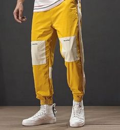 Sweat pants with patches on the knees. Drawstring. COLOR: mustard Yellow Spring Streetwear Joggers With Elastic Cuffs, Casual Yellow Cargo Pants With Pockets, Casual Yellow Cargo Pants With Side Pockets, Cotton Patchwork Pants For Streetwear, Streetwear Yellow Pants With Elastic Waistband, Streetwear Color Block Cotton Bottoms, Hip Hop Cotton Joggers For Spring, Hip Hop Cotton Bottoms For Jogging, Yellow Pants With Elastic Waistband For Streetwear