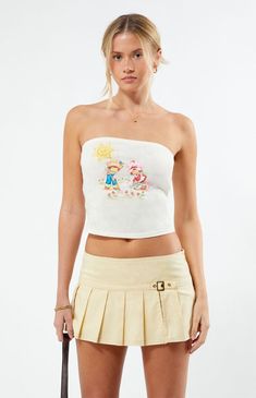 Sweeten up your style with the Strawberry Shortcake Graphic Tube Top. This fun top features a playful Strawberry Shortcake front graphic, a strapless design, and a cropped length for a trendy look.Solid color tube topStraplessStraight necklineStrawberry shortcake graphicCropped lengthFitted100% cottonMachine washableModel is wearing a size smallModel measurements: 5’8” height, 31” bust, 23” waist, 36” hips Strawberry Shortcake Womens Graphic Tube Top - White size Small Trendy White Strapless Tank Top, Playful Cropped Tops For Spring, Playful Fitted Tops For Day Out, Y2k Bandeau Crop Top For Spring, Cute Crop Top For Day Out, Y2k Bandeau Tube Top For Spring, Playful Crop Top For Summer, Fun Cotton Crop Top For Spring, Strapless Y2k Summer Tops