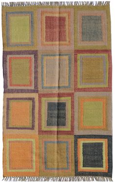 a multicolored rug with squares and fringes