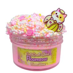 a pink tub filled with lots of candy and sprinkles on top of it