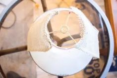 a white clock sitting on top of a glass table