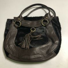 Kate Landry NWT Womens Brown Hand Bag Purse Tassel Haircalf $279 Condition: New With Tags Retail:  $279 Color: Brown, Black Size Hand Measured: Width 14.5" / Height 13" Tag: Tasseled Haircalf Elegant Brown Bags With Tassels, Elegant Brown Shoulder Bag With Tassels, Luxury Brown Shoulder Bag With Tassels, Luxury Travel Shoulder Bag With Tassels, Brown Hand, Tag Sale, Hand Bag, Bags Handbags, Tassels