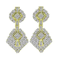 This is a charming pair of 18k yellow gold dangling earrings from the 1970s. The earrings feature sparkling round, baguette and princess cut diamonds that weigh approximately 10.00ct. The color of these diamonds is H-I with VS clarity. The earrings measure 45mm by 21mm and weigh 26.1 grams. The earrings are stamped 18K. Classic Gold Baguette Diamond Earrings, Classic Gold Diamond Earrings With Baguette Diamonds, Classic Gold Diamond Earrings With Baguettes, Gold Baguette Cut Diamond Earrings, Gold Baguette Cut Diamond Earrings With Accents, Formal Yellow Gold Diamond Chandelier Earrings, Gold Baguette-cut Diamond Earrings, Timeless Gold Diamond Earrings With Baguette Diamonds, Gold Baguette Diamond Earrings For Anniversary