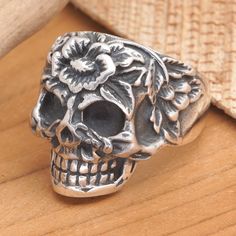 Floral details decorate this sterling silver cocktail ring's mystic aura with a touch of elegance, exploring the glamorous side of the gothic trend. Balinese artisan Gede Agus Mahardika handcrafts this captivating jewelry piece with advanced techniques, finishing the skull-themed front with a combination finish for a luxurious vibe. Luxury Polished Sterling Silver Skull Ring, Silver Gothic Skull Ring Collectible, Silver Skull Rings Hallmarked, Unique Silver Skull Ring Hallmarked, Silver Gothic Skull Ring, Collectible, Gift Suggestions, Floral Skull, Skull Jewelry, Jewelry Packaging