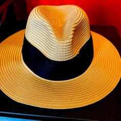 Approx. Dimensions: 22-1/2"L X 4"W; One Size Adjustable-Fit Band Packable Fabric Tie Trim Polyester Spot Clean Gold Curved Brim Straw Hat For Vacation, Gold Straw Hat With Curved Brim For Vacation, Gold Flat Brim Sun Hat For Beach, Gold Wide Brim Straw Hat For Summer, Gold Wide Brim Summer Straw Hat, Gold Short Brim Sun Hat For Beach, Chic Gold Wide Brim Sun Hat, Gold Flat Brim Hat For The Beach, Chic Gold Wide Brim Straw Hat