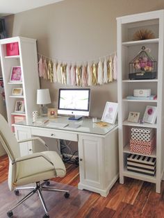 a white desk with a computer on top of it