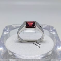 BAND - ROUNAK JEWELLERS MATERIAL - 925 STERLING SILVER GEMSTONE - 100% NATURAL GARNET GARNET STONE WEIGHT - 1.60 CT, STONE SIZE - 7 x 5 MM GROSS WEIGHT - 4.550 GM STONE SHAPE - EMERALD GEM COLOUR - RED RING SIZE- ALL SIZE AVAILABLE PLEASE GIVE YOUR OPENION OR FEEDBACK ABOUT THE PRODUCT. WE ACCEPT BULK ORDER ALSO. https://www.etsy.com/in-en/shop/RounakJewellers?ref=search_shop_redirect Formal Sterling Silver Ruby Ring, Formal Sterling Silver Ruby Ring With Round Band, Rectangular Stone Ring Hallmarked For Anniversary, Hallmarked Rings With Rectangular Stone For Anniversary, Modern Silver Ruby Ring For Formal Occasions, Classic Ruby Ring With Tension Setting For Gift, Classic Ruby Ring With Tension Setting As Gift, Rectangular Stone Hallmarked Rings For Anniversary, Modern White Gold Ruby Ring