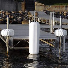 there are two white poles on the dock