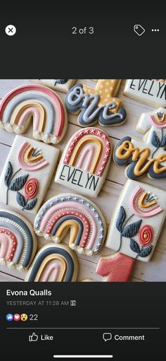 some cookies that are on top of a wooden table with the words love spelled in different languages