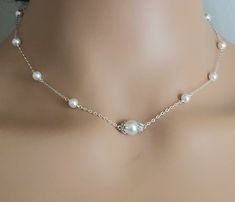 Wedding White Pearl Silver Dainty Choker Bridal Necklace with .925 Sterling Silver Chain. PLEASE READ ITEM DESCRIPTION and SHOP POLICIES before placing your order, and contact me with any questions! NECKLACE is about 16.41 inches (41.8cm) long. BRIDAL EARRINGS SECTION: https://www.etsy.com/shop/LanaChayka?ref=seller-platform-mcnav§ion_id=11638940 BRIDAL JEWELRY SETS SECTION: https://www.etsy.com/shop/LanaChayka?ref=seller-platform-mcnav§ion_id=25839214 BRIDAL NECKLACES SECTION: https://www.etsy. Adjustable Silver Pearl Necklace For Wedding, Pearl White Round Bridal Necklace, Adjustable Pearl Chain Bridal Necklace For Weddings, Dainty White Gold Pearl Necklace For Wedding, Silver Pearl Bridal Necklace For Marriage, Silver Bridal Necklace With Pearl Chain For Wedding, Classic Silver Bridal Necklace For Mother Of The Bride, Adjustable Pearl White Bridal Necklace, Adjustable Classic Pearl Necklace For Wedding