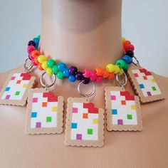 This kandi necklace is made with rainbow pony beads and pastry charms. One size fits all. This Item adjust up to 17 Inches.  This Item is made to order. Perfect for any event! You will get lots of compliments in this unique wearable art! Stand out at your next event! Edm festival  Raves Party  Rave outfit  Festival outfit Pride Rave Multicolor Choker For Festivals, Rave Style Multicolor Choker, Handmade Multicolor Rave Necklaces, Kandi Perler Beads, Kandi Bag Pattern, Kandi Belt, Kandi Harness, Kandi Choker, Rave Necklace