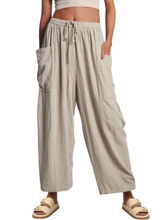 PRICES MAY VARY. The perfect summer, vacation, lounge, going out, staying in, casual, dress up or down pants! Thess harem-inspired pantslooks good on every body type, with every outfit, and are even comfy enough to nap in Crafted from soft breezy linen blend fabric, this pant is as comfortable as it is classic. It is designed in a wide-leg silhouette and features elastic waistband, drawstring detail and dropped side pockets for added volume. Pair it with your favorite tee or effortlessly thrown Baggy Harem Pants For Vacation, Casual Baggy Harem Pants For Vacation, Baggy Casual Harem Pants For Vacation, Solid Color Vacation Harem Pants With Pockets, Casual Wide-leg Harem Pants For Vacation, Non-stretch Casual Harem Pants For Summer, Casual High-waisted Harem Pants For Beach, Wide Leg Harem Pants With Pockets For Beach, Baggy Bottoms For Leisure In Summer