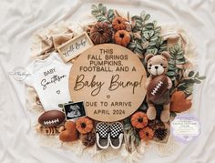 a baby announcement surrounded by items such as football, pumpkins and a teddy bear