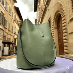 This bag has been made of the best genuine leather by local master crafters of Florence in Italy, designed for women who only accept premium Italian quality and luxury leather bags and modern Italian fashion. . Size: Width: 27 cm / 10.75 inches Height: 19 cm / 7.50 inches Depth: 9 cm / 3.50 inches Color: Mint Green . The story of this bag : Once upon a time, in the charming city of Florence, Italy, renowned for its exquisite artistry and craftsmanship, there existed a small workshop tucked away Leather Bucket Bag With Smooth Grain For Office, Calf Leather Bucket Shoulder Bag With Smooth Grain, Luxury Textured Leather Hobo Bag For Daily Use, Luxury Soft Leather Bucket Bag For Office, Luxury Green Bucket Bag For Daily Use, Smooth Grain Calf Leather Bucket Bag, Luxury Leather Bucket Bag With Smooth Grain, Daily Use Calf Leather Shoulder Bag With Smooth Grain, Smooth Grain Calf Leather Shoulder Bag For Daily Use