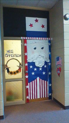 a door decorated with an american flag and santa clause