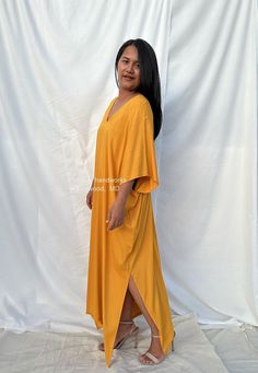 Celebrate your curves with our plus size kaftan dress. Created to embrace all body types, this kaftan is designed with care and style in mind. Its loose, flowing silhouette complements your figure while offering unbeatable comfort. The perfect choice for a night on the town or lounging at home. Oversized V-neck Tunic For Beach Cover-up, Flowy V-neck Midi Dress For Loungewear, V-neck Beachwear Maxi Dress For Loungewear, V-neck Beachwear Maxi Dress, Beachwear V-neck Maxi Dress For Loungewear, V-neck Relaxed Fit Maxi Dress For Loungewear, Relaxed Fit V-neck Maxi Dress For Loungewear, Oversized Maxi Dress For Loungewear, Oversized Summer Dresses For Loungewear