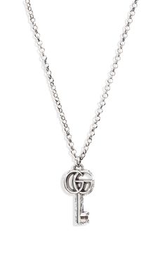 The emblematic double-G tops a key pendant with a flowing arabesque design on this bold chain-link necklace. Style Name:Gucci Gg Silver Key Necklace. Style Number: 6134022. Elegant Gucci Chain Necklace, Classic Gucci Pendant Jewelry, Gucci Classic Pendant Jewelry, Classic Silver Gucci Necklaces, Gucci White Gold Pendant Necklace, Classic Gucci Chain Jewelry, Gucci Silver Sterling Silver Necklace, Elegant Gucci Chain Link Jewelry, Gucci Sterling Silver Necklace