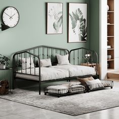 a living room with a day bed and clock on the wall next to bookshelves