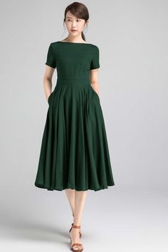 1950s Style A-line Pleated Dress, 1950s Style Fit And Flare A-line Vintage Dress, 1950s Style A-line Midi Dress For Formal Occasions, Elegant Cotton A-line Vintage Dress, Cotton A-line Midi Dress For Garden Party, 1950s Style A-line Dress With Box Pleat, Summer Vintage A-line Pleated Dress, Vintage A-line Dress With Pleated Waist, Summer Midi Dress With Box Pleat And Short Sleeves