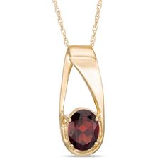 On-trend and oh-so attractive, this intriguing gemstone pendant is a gorgeous fashion find. Crafted in warm 10K gold, this unique design features an 8.0 x 6.0mm oval-shaped regal red garnet at the base of an oblong offset slip-bail style. Buffed to a brilliant luster, this dainty birthday-ready or anytime pendant suspends along an 18.0-inch rope chain that secures with a spring-ring clasp. Garnet And Gold, Garnet Pendant, Garnet Stone, Red Stone, Red Garnet, Rope Chain, 10k Gold, Necklace Designs, Spring Rings