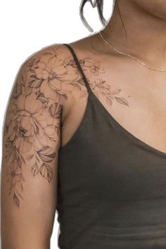 a woman with a flower tattoo on her arm