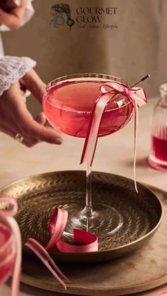 Pink glass filled with cocktail and decorated with pink ribbon and hand reaching for that drink. Cocktail photography Spring Cocktail Party, Bachelorette Party Cocktails, Rhubarb Cocktail, Sparkle Cocktail, Rhubarb Juice, Rhubarb Syrup, Bachelorette Drink, Spring Cocktail, Ginger Liqueur