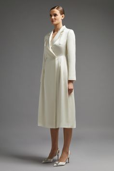 Style: Shirt DressFabric: CrepeLength: MidiNeckline: CollaredSleeve Length: Long Sleeve Modern Mother Of The Bride, Bride Collection, Wrap Shirt Dress, Ivory Dress, Dress Long Sleeves, Crochet Clothing, Wrap Shirt, Ivory Dresses, In The Spotlight