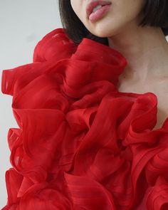 The Ellaella Pouf Dress is a stunning display of haute romance, made to order for special occasions and red-carpet affairs. This bold artful dress is entirely made by hand with couture sewing techniques, with each red silk organza hand-pleated bloom stitched, gathered, and sewn on by our skilled team in New York. 100% silk organza Upon placing your order, please e-mail us at info@jasminechong.com with order number and sizing information. Added customisation (lengthening, etc.) may incur addition Silk Couture Evening Dress For Parties, Red Organza Floor-length Dress, Red Floor-length Organza Dress, Red Fitted Bodice Organza Dress, Red Fitted Organza Gown, Elegant Red Organza Evening Dress, Red Organza Dress For Gala, Red Organza Evening Dress, Silk Evening Gown With Ruffles