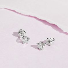 Set in a traditional jeweler's 5 prong setting, these simulated birthstone earrings are elegant and timeless. The flawless 4mm cubic zirconia stones are set entirely in 925 sterling silver, a naturally HYPOALLERGENIC fine metal. These earrings feature threaded posts and a safety back system to ensure your child's earrings stay comfortably in place. Choose your toddlers birth month stone or favorite color. A complimentary gift box is included for easy giving! Birth Month Stone, Birth Month Stones, Birthstone Earrings, Kids Earrings, Birthstone Earring, Birth Month, Girls Shopping, Prong Setting, Favorite Color