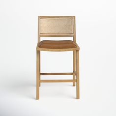 a wooden chair with brown leather seat and backrests on a white background,