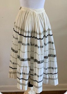 For your consideration Vintage "Made Especially For You by Lil-Beth" patio skirt with silver metallic trim. Feels like cotton gauze. Fits like an XXS / 22" waist but could be reworked - there is room in the pleats to take out.  Pre owned, shows general wear. Faint discoloration in areas and some obvious discoloration on the waistband. The waistband has seam separations on the inside  Shown on size small mannequin - it was too small and had to be pinned for viewing. Please review photos and messa Western Patio, 1950s Western, Small Mannequin, Sparkle Skirt, Square Dance, Square Dancing, Ric Rac, Rodeo, Favorite Outfit