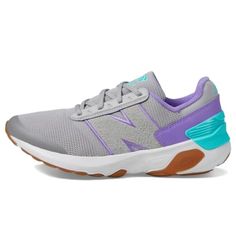 a woman's grey and purple sneaker with two tone detailing on the side