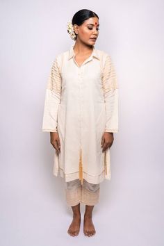 Cream shirt tunic with frayed denim applique embroidery on sleeves. Paired with inner, pant and neck tie. - Aza Fashions Cotton Kurta With Set-in Sleeves For Eid, Long Sleeve Cotton Silk Kurta With Embroidered Sleeves, Long Sleeve Chikankari Kurta For Work, Spring Long Sleeve Kurta With Tassels, Cotton Silk Kurta With Embroidered Sleeves, Embroidered Long Sleeve Kurta For Work, Cotton Blouse With Embroidered Cuffs For Work, Spring Kurta With Embroidered Cuffs And Long Sleeves, Cotton Kurta With Embroidered Hem For Eid