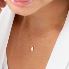 Gold teardrop necklace is a minimalist design crafted in 14k solid gold and is perfect for everyday wear. Its understated charm and high quality craftsmanship ensure it will be a beloved part of your jewelry collection for years to come. NECKLACE DETAILS * Material:14 carat solid gold * Weight: 1.38 grams (with 16 inch chain) * Dimensions: 6mm x 9mm * Chain: Cable * Style: Minimalist * Free Express Shipping Worldwide * 100% Handmade * Gift wrapping * Yellow and rose gold options are available * Dainty 14k Gold Teardrop Pendant Charm Necklace, Dainty 14k Gold Teardrop Charm Necklaces, Dainty Teardrop 14k Gold Charm Necklaces, Minimalist 14k Gold Teardrop Pendant Necklace, Dainty 14k Gold Teardrop Charm Necklace, Dainty 14k Gold Teardrop Pendant Necklace, Dainty Teardrop Yellow Gold Charm Necklace, Minimalist 14k Gold Drop Necklace With Delicate Chain, Dainty 14k Gold Teardrop Drop Necklace