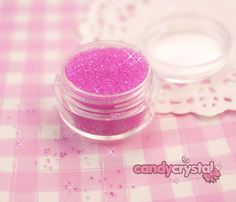 5ml pot of pink sugar faux sprinkles for decoden - £1.25  http://candy-crystal.co.uk/diy-deco-supplies/deco-sauces-glues/pink-sugar-deco-sprinkles-topping-for-decoration-of-miniature-sweets.html  SKU: 029 Pink Sugar, Scrapbook Supplies, Craft Items