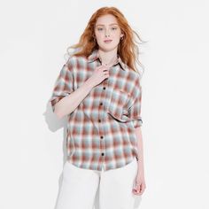 Flannel button-down shirt from Wild Fable™ with a plaid pattern. Made from lightweight cotton. Designed in an oversized fit with a collared neckline, full front button-down closure, chest patch pocket and long sleeves with buttoned cuffs. Tunic-length shirttail hem completes the stylish look. If you're not satisfied with any Target Owned Brand item, return it within one year with a receipt for an exchange or a refund. Wild Fable™: A look for every story. Pocket Tunic, Oversized Flannel, Brown And Blue, Brown Plaid, Hem Style, Rolled Hem, Lace Shirt, Tunic Length, Wild Fable