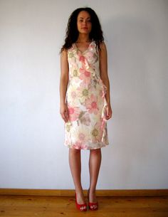 "Vintage Floral summer dress, Peach pink cosmos flower print gown, creppe ruffle dress, women lined sundress, gift for her, size medium Fit/Size:  Medium (EUR 38) Measurements: Length: 42\" Bust: 33\" Hips: 38 Please check measurements to insure a proper fit. Remember to allow yourself some extra room for movement. You can compare these with something from your closet that fits you well. Please convo me if you need additional measurements. This dress will come to you freshly laundered and ready to wear. Condition: great Vintage Condition SHIPPING * I ship worldwide via Priority mail (Latvijas Pasts) from Latvia (EU). * I ship from Europe, so please allow 2 to 4 weeks for the package to arrive if you live overseas. * Europe 5 - 10 business days. Go back to my shop: VintageDreamBox.etsy.com Fitted Midi Sundress With Ruffle Hem, Fitted Ruffle Hem Summer Dress, Elegant Chiffon Sundress With Ruffles, Elegant Pink Knee-length Sundress, Pink Chiffon Sundress For Spring, Fitted Summer Dress With Ruffle Hem, Fitted Summer Sundress With Ruffles, Feminine Fitted Floral Dress With Ruffles, Fitted Feminine Floral Dress With Ruffles