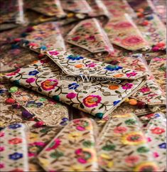 several pieces of cloth with colorful flowers on them