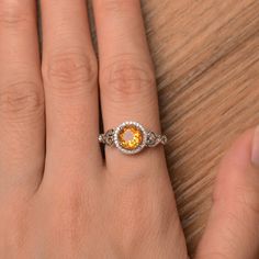 It is a natural citrine ring. The main stone is 7mm*7mm round cut, weight about 1.25 carats. To change the metal to a solid gold (white/rose) or platinum is also available, please ask for a quotation if you want. You can also go to my shop Home for more elegant rings: https://www.etsy.com/shop/godjewelry?ref=hdr_shop_menu citrine is November birthstone Customization is always welcome and please feel free to contact with me if you have any design ideas! Yellow Gemstone Ring, Engagement Ring Round Cut, Round Cut Ring, Citrine Ring Engagement, Elegant Rings, Engagement Ring Round, Yellow Gemstones, Round Cut Engagement Rings, Engagement Rings Round