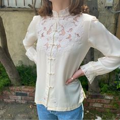 Vintage Hand Embroidered Mandarin Collar Silk Blouse In The Color White Long Sleeve White Silk Blouse Size - 32 Equivalent To Size Extra Extra Small Size - 34 Equivalent To Size Extra Small Size - 36 Equivalent To Size Small - Brand Is Peony - Brand New - Never Been Worn - 100 % Pure Silk - Multiple Sizes Spring Daywear Tops With Stand Collar, Spring Stand Collar Blouse For Daywear, Stand Collar Blouse For Spring Daywear, Stand Collar Blouse For Daywear In Spring, Embroidered Stand Collar Blouse For Spring, Spring Embroidered Blouse With Stand Collar, Embroidered Spring Blouse With Stand Collar, Embroidered Blouse With Stand Collar For Spring, Spring Traditional Tops With Stand Collar