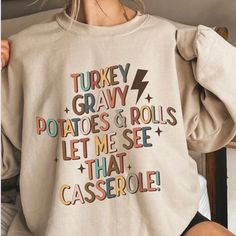 Turkey Gravy Sweatshirt, Thanksgiving Shirt, Family Shirts, Fall Sweatshirt, Casserole Shirt, Funny Thanksgiving Tee, Autumn Crewneck Youth Kids Shirts, unisex Tshirt and Sweatshirt Available! DTG PRINTING Sizes: S M L XL 2X 3X 4X 5X Handmade  Unisex Fit Crewneck Sweatshirts 50/50 cotton polyester  Long Sleeve TEES 100% Cotton Sizes:  Youth Tee: XS-XL Unisex Tees: S-5X *TRUE TO SIZE.  Size up if you want it oversized. Great for: Matching Group Shirts Funny sweaters Gifts for her Gifts under $50 Funny Long Sleeve Tops For Fall, Funny Cotton Tops For Fall, Funny Long Sleeve Shirt With Letter Print, Thanksgiving Tee, Turkey Gravy, Funny Sweaters, Happy Thanksgiving Day, Group Shirts, Star Sweater