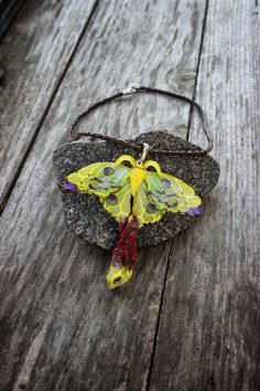 The Wonderful yellow-green luna moth jewelry. The Actias luna moth making it one of the largest moths in North America. This perfect boho jewelry made of polymer clay. You will get the pendant with the leather cord, so please, choose the length. The size of the butterfly is 3.14 * 3.14 inch You will like this summer jewelry! Green Hand Painted Spiritual Jewelry, Hand Painted Green Spiritual Jewelry, Spiritual Hand Painted Green Jewelry, Yellow Jewelry With Butterfly Charm For Gift, Yellow Butterfly Jewelry Gift, Nature-inspired Green Necklace For Festival, Nature-inspired Green Necklace For Festivals, Green Nature-inspired Jewelry For Festivals, Green Bohemian Hand Painted Jewelry