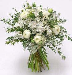 a bouquet of white flowers and greenery