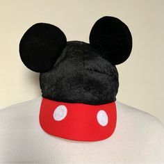 a close up of a mickey mouse hat on a mannequin's head