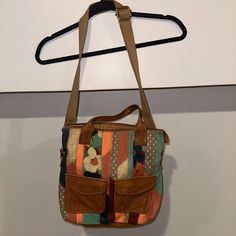 Fossil Cargo Multi Color Canvas W/Leather Trim Fold-Over Tote Crossbody Bag Nwot - 2 Carry Handles And Long Adjustable/Detachable Strap To Carry As Shoulder Bag Or Crossbody Bag - Front Of Bag With 2 Flap Pockets With Snap Closure - Logo Plate On Back - Top Zip Closure With Brown Lining With 4 Slip Pockets And 2 Card Slots And Large Zip Pocket Multicolor Shoulder Bag With Adjustable Handle For On-the-go, Retro Crossbody Satchel For Errands, Retro Crossbody Shoulder Bag For Errands, Spring Leather Satchel With Adjustable Strap, Vintage Bags With Adjustable Strap For Fall, Vintage Bags With Zipper Closure For Fall, Retro Fall Bag For Daily Use, Retro Bags With Adjustable Strap For Errands, Spring Leather Bag With Adjustable Strap